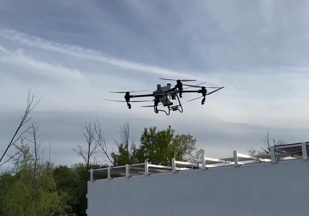 Drone in flight over field