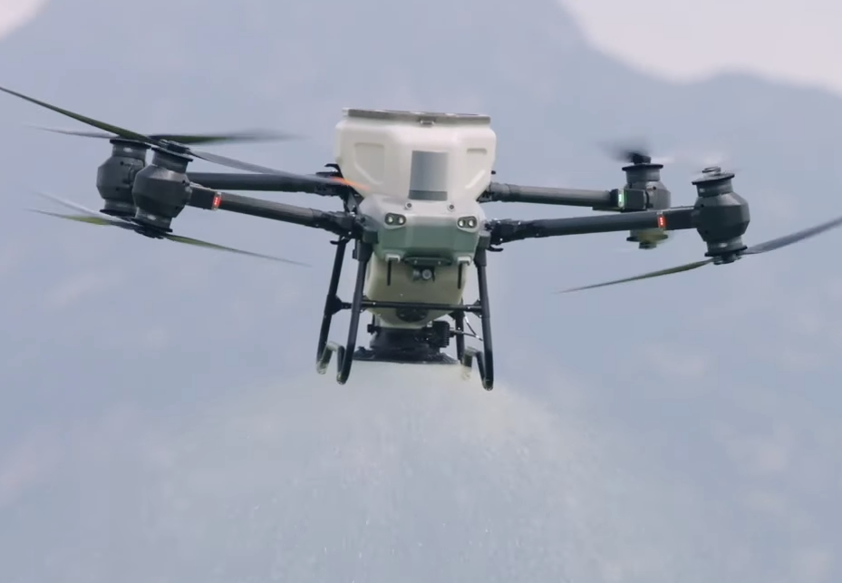 Drone spraying agricultural field